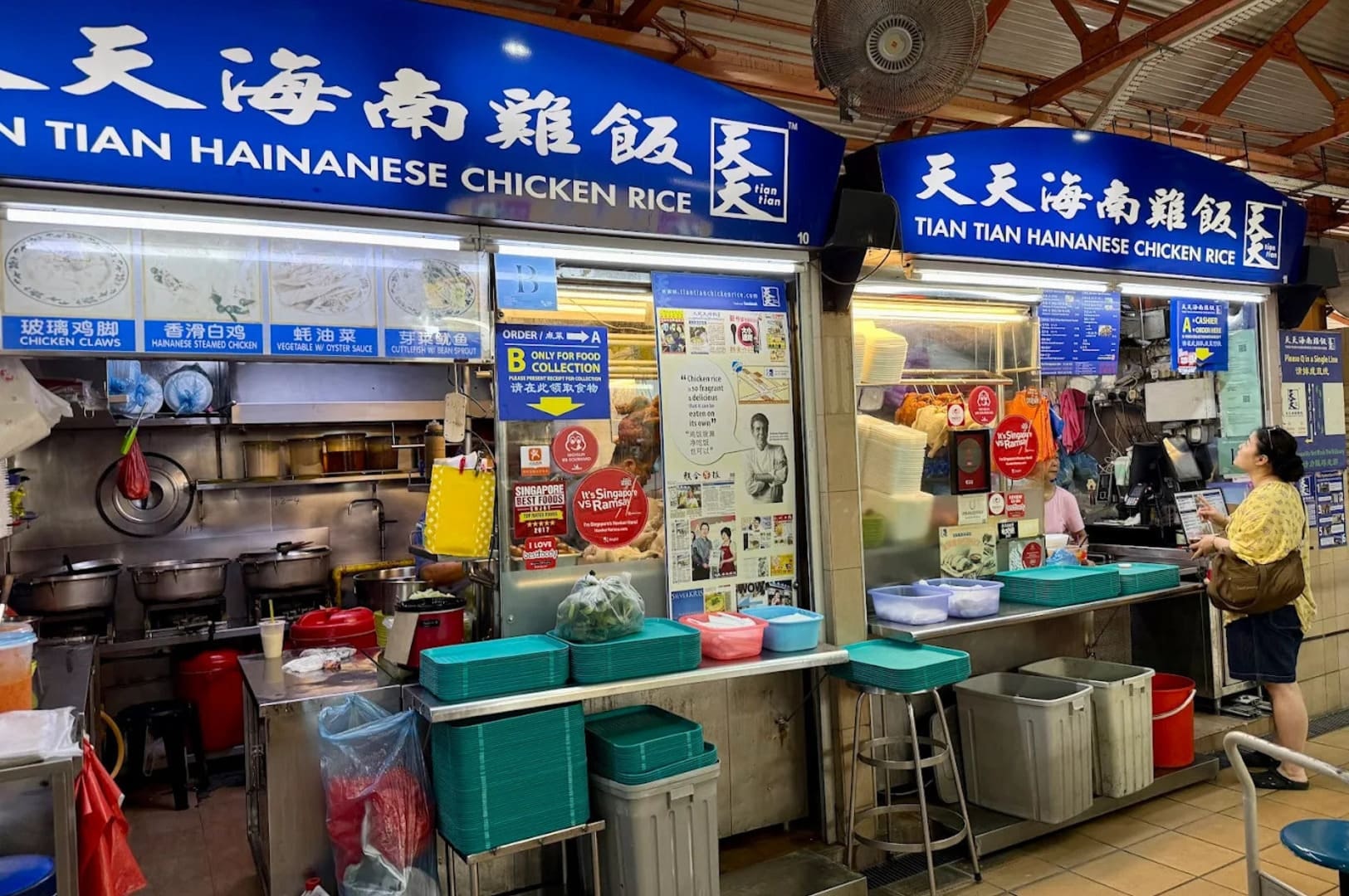 People standing in front of a food stall at Maxwell Hawker Centre, showcasing a lively dining experience. Photo by Google.