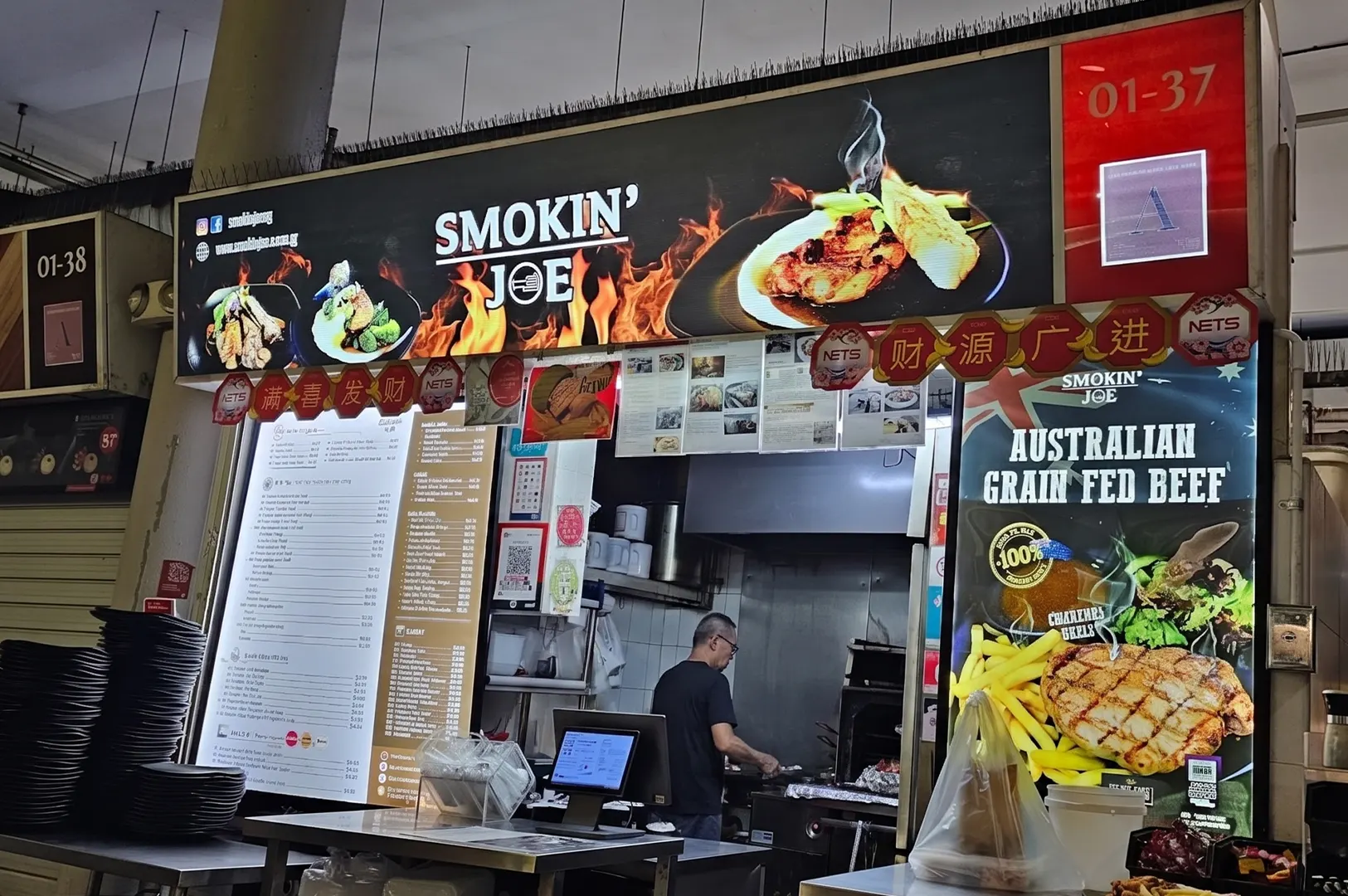 Smokin' Joe western food hawker stall displaying a menu and Australian grain fed beef poster.
