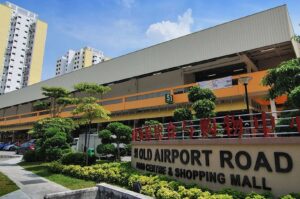 Exterior view of the Old Airport Road Food Centre in Singapore, showcasing a bustling shopping mall atmosphere. Photo by Time Out.