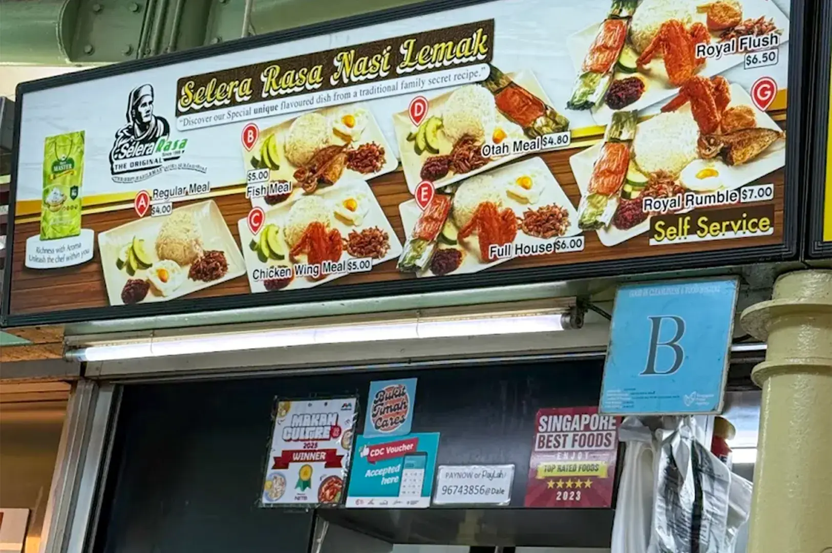Selera Rasa Nasi Lemak food stall menu board displaying various meal sets, including Regular, Fish, Chicken Wing, Otah, Full House, Royal Flush, and Royal Rumble.